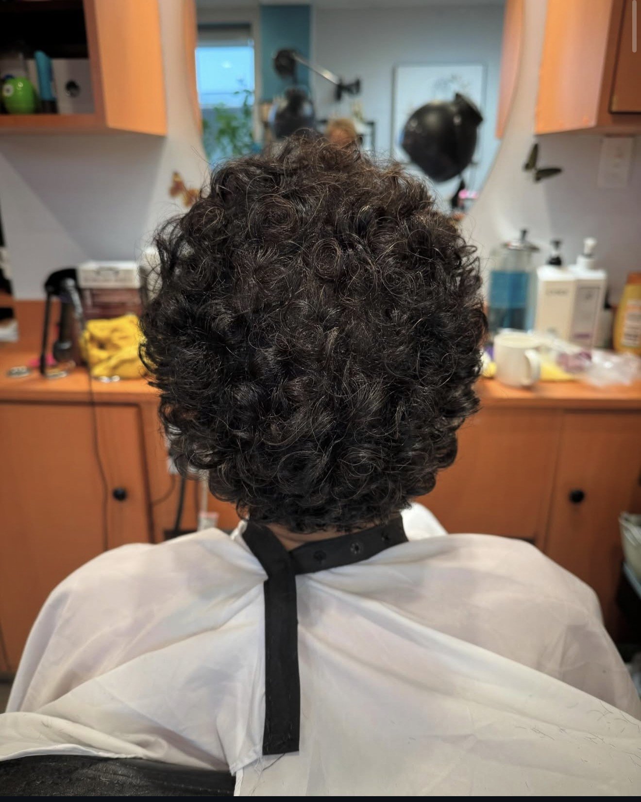 Curly perm hairstyle, back view