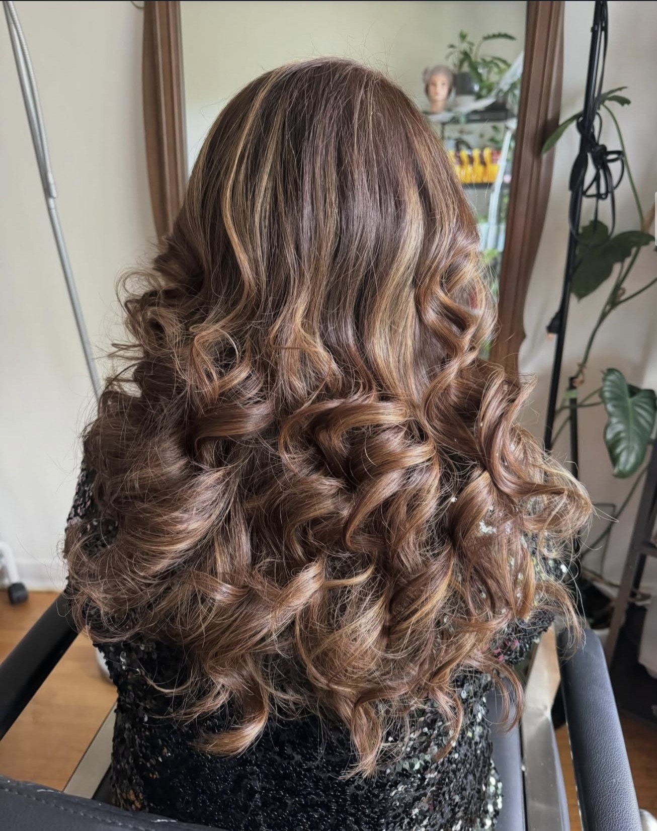 Curled hair with caramel highlights