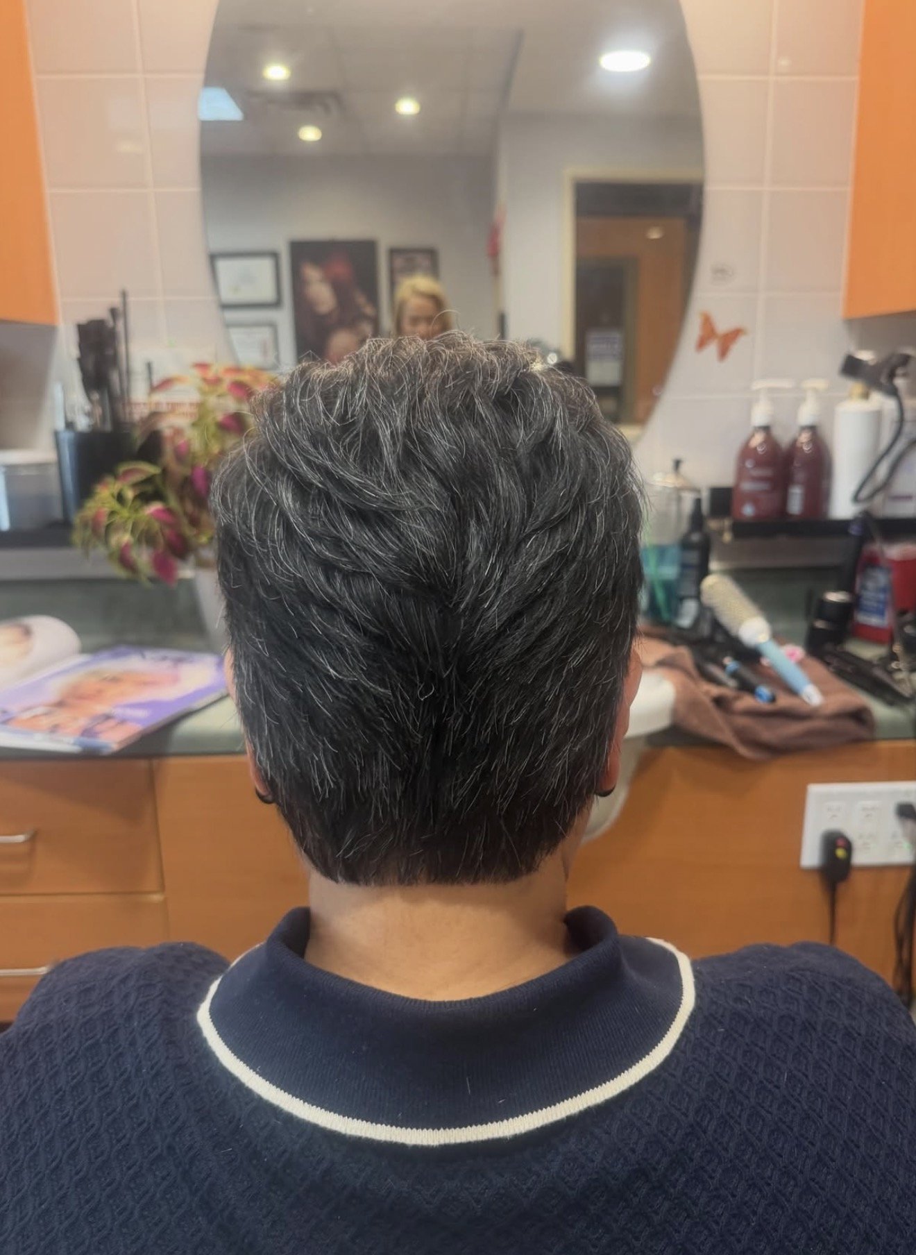 Men's short textured haircut, back view